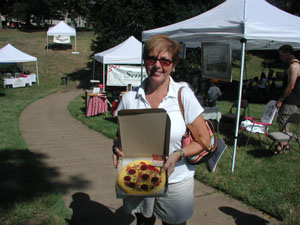 customer holding pizza